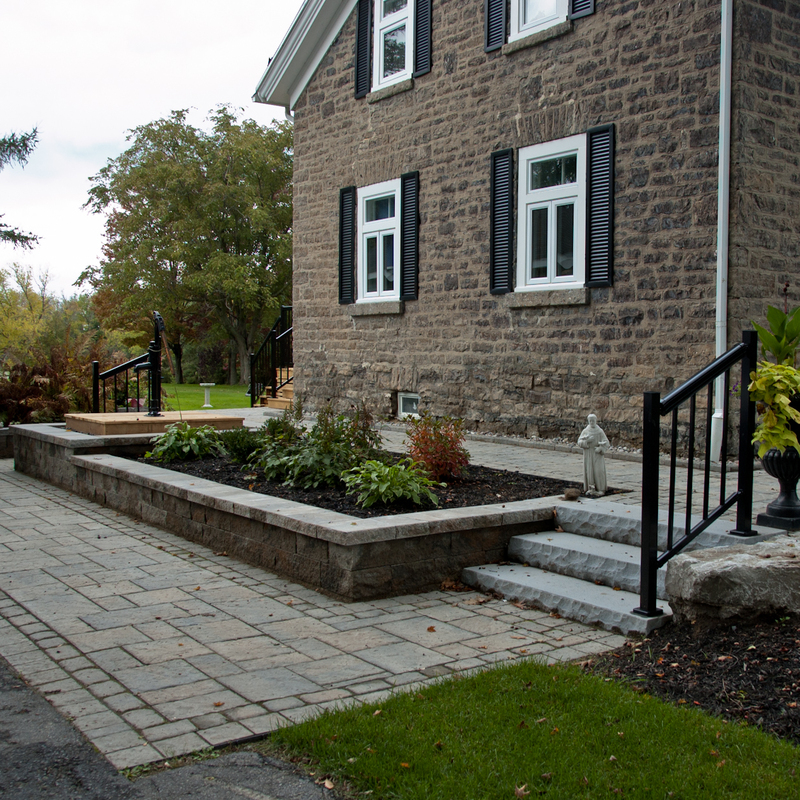 Entrance landscaping with gardens