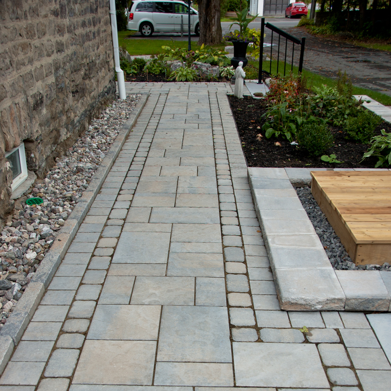 Entrance landscaping with gardens