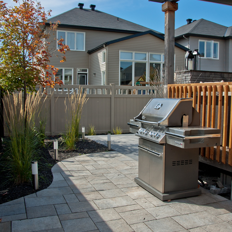 Backyard landscaping with gas fireplace