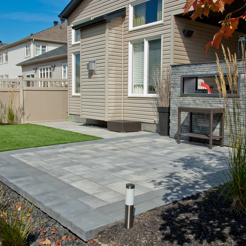 Backyard landscaping with gas fireplace