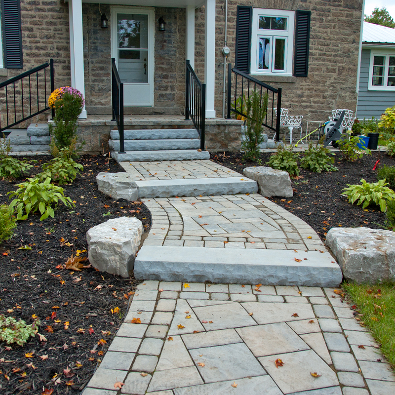 Entrance landscaping with gardens