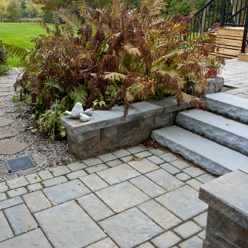 Entrance landscaping with gardens